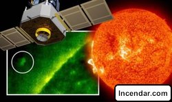 UFO sighting NASA satellite snaps alien spacecraft bigger than Earth near the Sun AN ALIEN UFO has been photographed by a NASA satellite orbiting the Sun, a self styled ET expert has announced.